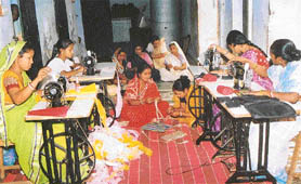 Leather pouches and bags being stitched by the women at Vrindavan.