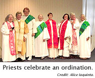Priests celebrate an ordination.