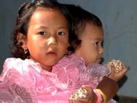 Children eat kobok, a local sweet / Ratan Luwangcha - Drik
