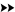 Right-facing double black arrows