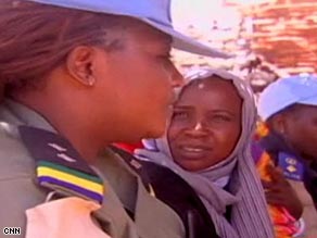 UNAMID police officer Ajayi Funmi, left, educates Darfur women about rape.