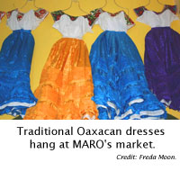 Traditional Oaxacan dresses hang at MARO's market.
