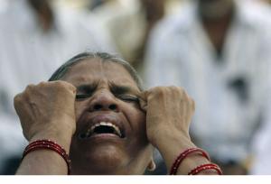 A woman shows her grief at the religious violence in Orissa during a
gospel hymn service