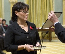 Health Minister Leona Aglukkaq is sworn in by clerk of the Privy Council Kevin Lynch, during a ceremony at Rideau Hall in Ottawa on Thursday.