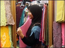 A Muslim woman in Malaysia in a textiles shop