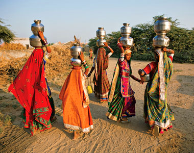 India: wishers: In India's Hodka village, Meghwal women gather to collect and carry water. The hell