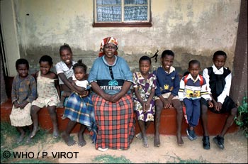 A member of the community takes care of children orphaned by AIDS, Lesotho