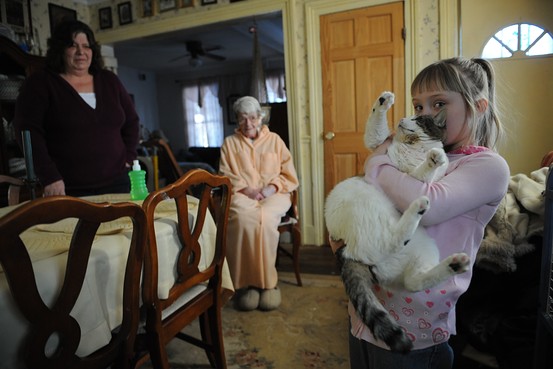 Wendy Nocar, 57, at home with her six-year-old granddaughter, Summer, cat Squeaky and her mother, Sally Goldberg, 79.