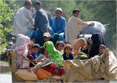 An internally displaced family on a truck in Malakand, near the Swat valley region of Pakistan, on Thursday.