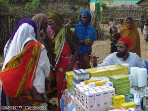 Somali women wait to get medicine at a clinic near Mogadishu in July.