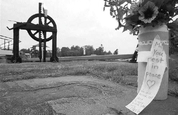 Flowers mark the site at the Kingston Locks on the Rideau Canal where three teenagers -- Zainab, Sahari and Geeti Shafia -- and Rona Amir Mohammad, were found dead.;The girls' parents and brother have been arrested on murder charges. Many are reluctant to discuss the possibility that family honour was a motive.