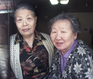 Former 'Comfort Woman' Gil Won-Ok (right) and friend at the Korean Shelter for Comfort Women