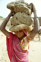 Young girl, a bonded labourer, working in a brick factory -  ILO Photo/Lissac