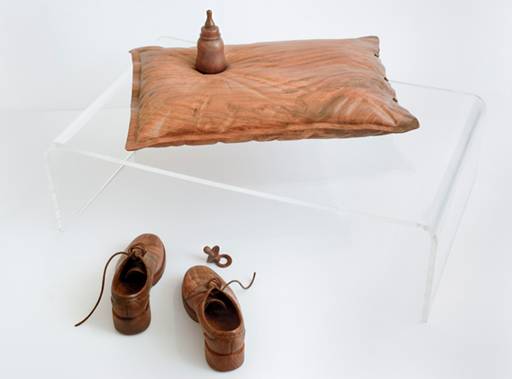 carved shoes, pillow and baby bottle