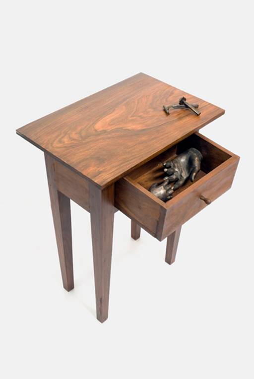 carved sidetable with hand in drawer
