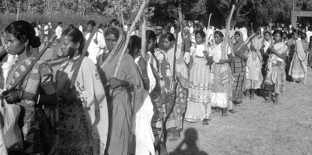 With their traditional weapons, Adivasi women join a huge mobilisation at Chakadoba village in Medinipur district of West Bengal, India.