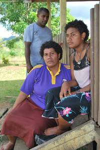 Clothes gone wrong ... Asenaca Vunibola, right, with her father Tui and mother Sala after her traumatic experience at Naqai outside Labasa yesterday. 