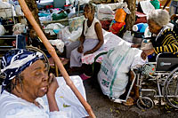Women rest outside the hospital for the elderly that collapsed during the January earthquake in Haiti -  OHCHR  MINUSTAHPhoto Marco Dormino