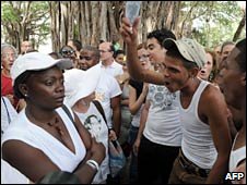 Cuban pro-government citizens surround and shout slogans to the Ladies in White in Havana