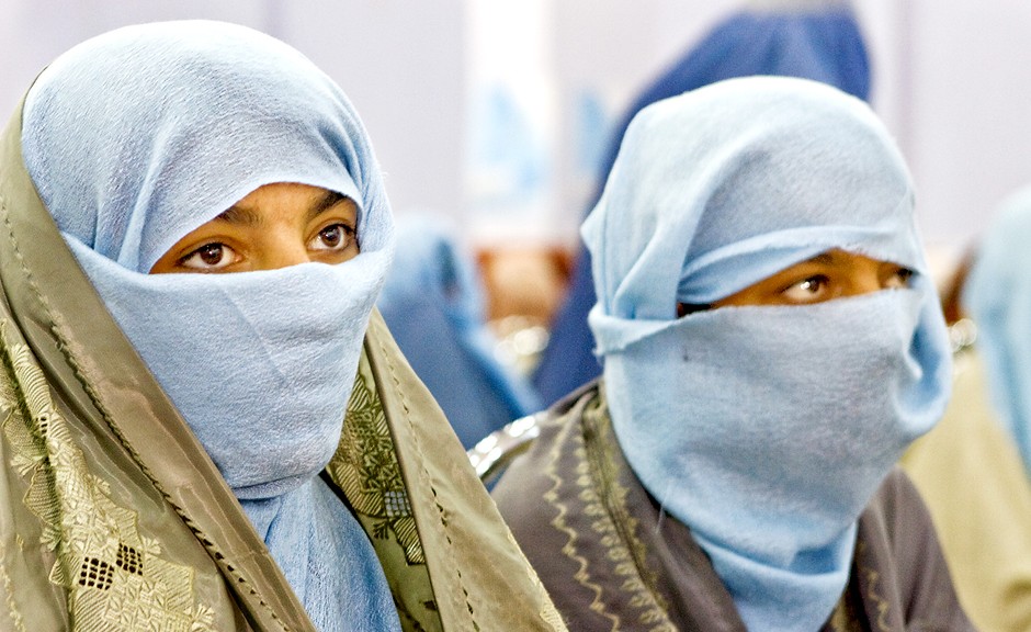 Teenage girls attend an event to pray for peace to commemorate  International Women's Day in Kandahar City, one of the most volatile parts of Afghanistan.  In a region where women seldom leave home for any reason, a public gathering like this one of hundreds of women is unusual and attests to their strong wish to advocate for peace.