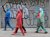 File -  In this June 15, 2010 file photo women wearing veils walk in Barcelona, Spain. Spanish lawmakers will debate Tuesday July 20, 2010, barring bu