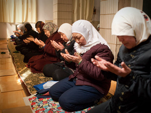 The faithful pray at a mosque for somen