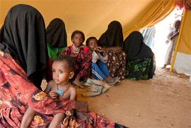A displaced family in their tent at Mazraq refugee <br/>
camp, October 2009. Photo: IRIN/Paul Stephens