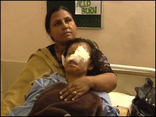 Saira Liaqat, after surgery, supported by her mother, Gulshan