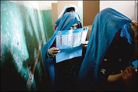 Women vote in Afghanistan, where 2,500 people ran for 249 seats in parliament. The Taliban warned voters to avoid the polls.