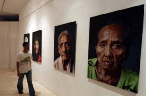 The exhibition Jugun Ianfu - Comfort Women features portraits of 18 women, most of whom are now in their late 70s or early 80s. Accompanying text tells the stories of the women and their experiences during World War II.  (JG Photos/Safir Makki and Amee Enriquez)