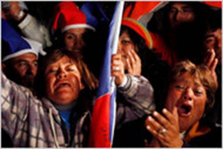 Relatives and friends of trapped miners celebrated while watching the rescue operation of Florencio valos.