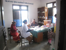 A patient being checked by a nurse at Satungal Health Post, Kathmandu, Nepal. / Credit:Damakant Jayshi/IPS