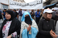 Protesters in Morocco holding placards requesting reforms  EPA/Karim Selmaqui