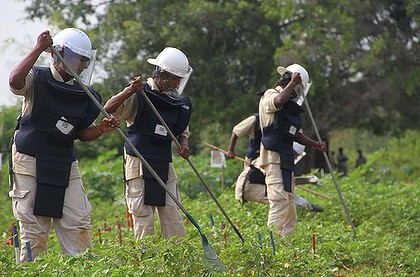 Egambaram Renathani (centre) is part of an all-female team training to remove hundreds of thousands of landmines laid during Sri Lanka's civil war.