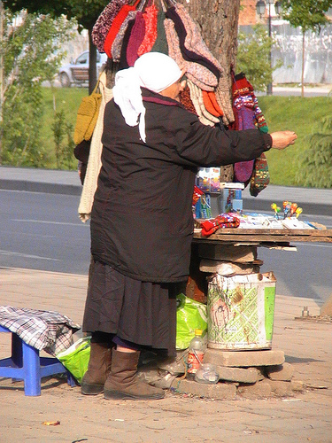 Woman selling socks in Albania's capital city, Tirana
