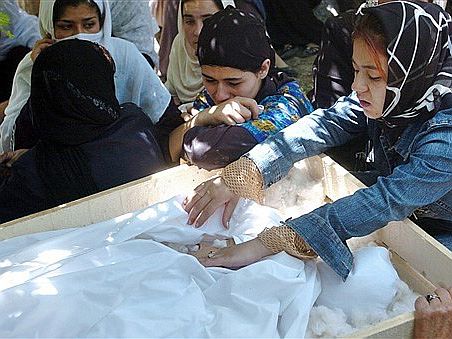 Children of slain Afghan journalist Zakia Zaki mourn at funeral