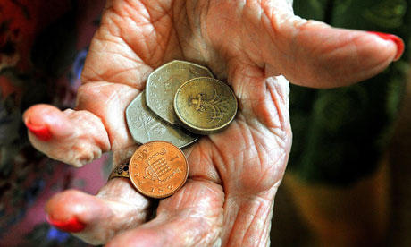 older person holding cash