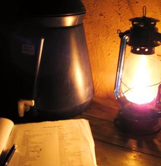 Reading by kerosene lamp in Malawi