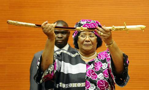 Joyce Banda, Malawi's first female  president, holds a ceremonial sword at her inauguration in the capital Lilongwe on April 7, 2012. Banda told her supporters there was "no room for revenge" after the divisive Bingu wa Mutharika died in office.
