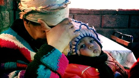 An Uzbek woman and child