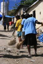 Women clearing the streets in Haiti after the 2010 earthquake