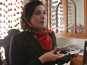 Soraya Paksat of Voice of Afghan Women holds a knife that was confiscated from a woman who came to visit a young relative in one of the group's shelters. The woman intended to kill the girl for fleeing an abusive father.