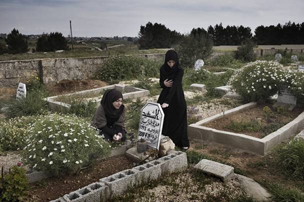 Two women at a grave
