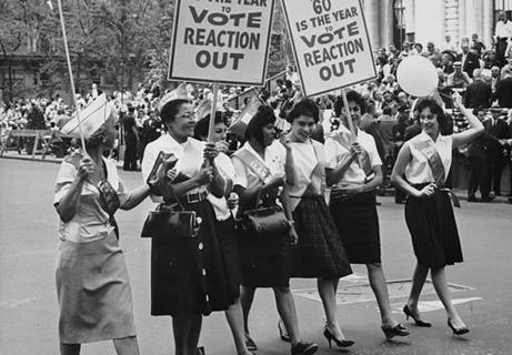 African American women march in a Labor Day parade in 1960