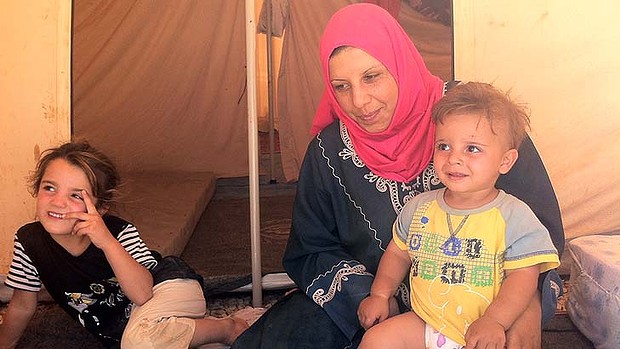 Nasim Abu Ziad with two of her four children at Zaatari refugee camp in Jordan.