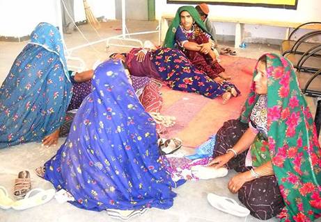 Women await their turn for sterilization at a primary health center in Rajasthan.