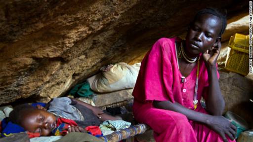 Many Nuba hide in caves to escape the bombs, says Nyange. Pictured, a mother rests with her child in a cave outside of Tess, South Kordofan, in April 2012. 