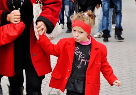A young girl walks in Tirana during celebrations for Albania's 100th independence anniversary, Nov. 28, 2012.