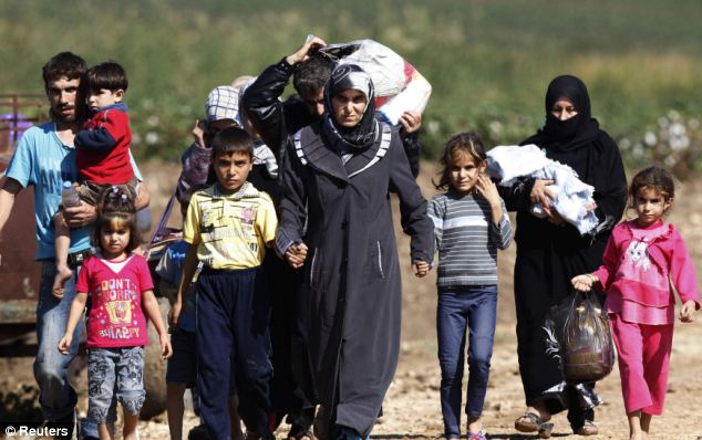 Grave fears: Thousands have fled the Syrian civil war, which now threatens to spread to Turkey