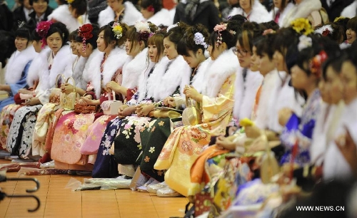 Young girls dressed in traditional kimonos attend the annual Coming-of-Age Day ceremony at an amusement park in Tokyo, Japan, Jan.14, 2013. People who turned 20-year-old take part in the annual Coming-of-Age Day ceremony on the second Monday of January in Japan. (Xinhua/Kenichiro Seki) 